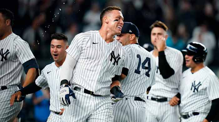 New York Yankees’ Aaron Judge celebrates with teammates after hitting a walk-off three-run home run during the ninth inning of a baseball game against the Toronto Blue Jays Tuesday, May 10, 2022, in New York. The Yankees won 6-5.